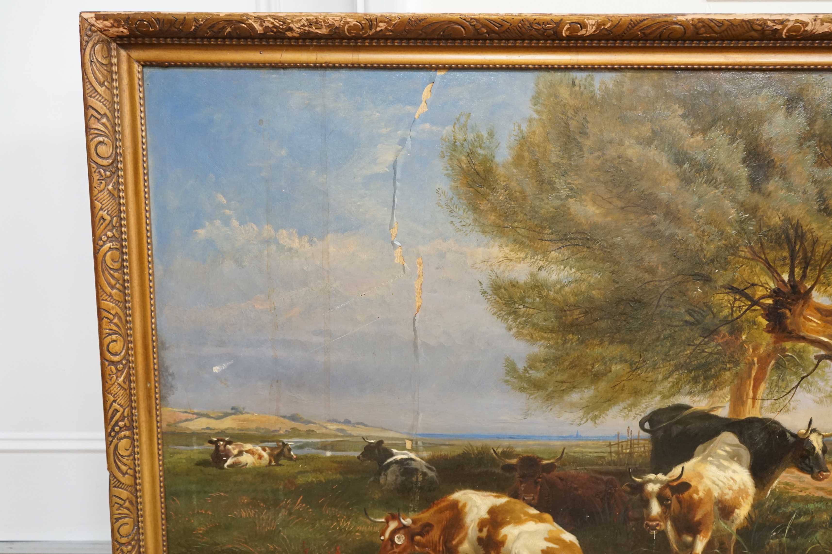 After Thomas Sidney Cooper (1803-1902), oil on canvas, Pastoral landscape with cattle by a pond, inscribed plaque to the frame, 64 x 110cm (badly water damaged)